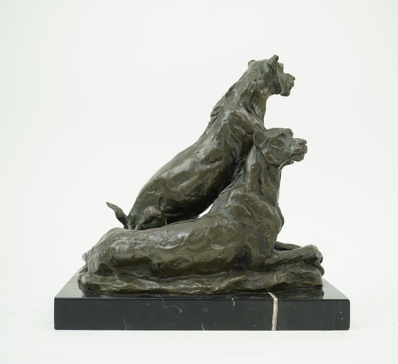 Miguel Fernando Lopez (Portuguese, contemporary): A painted bronze group of two lionesses